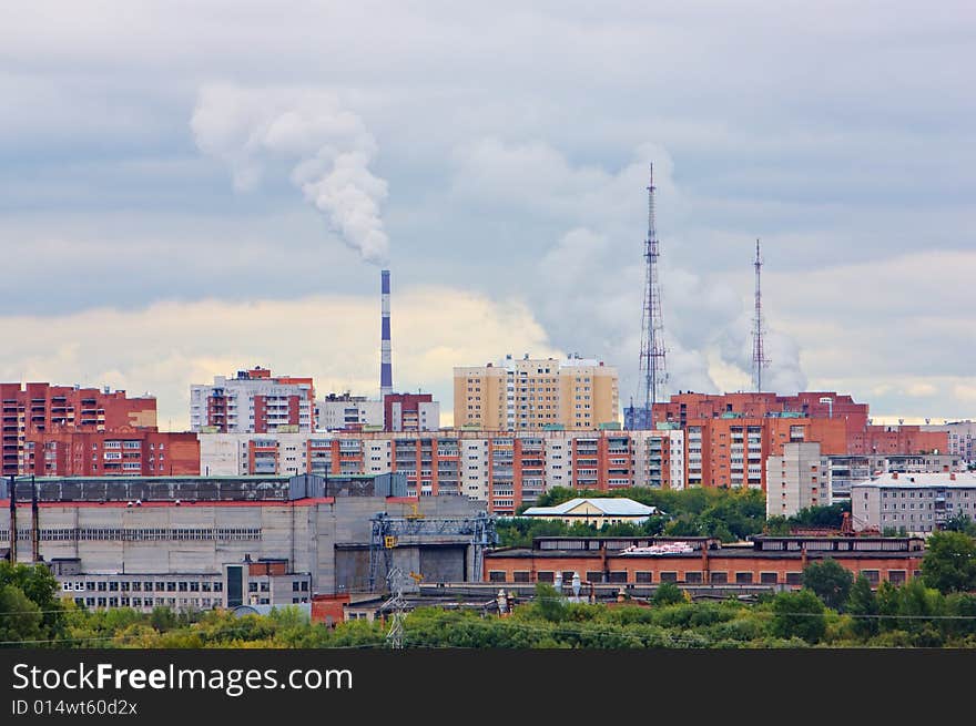 Urban scene with energy factory, construction factory and houses