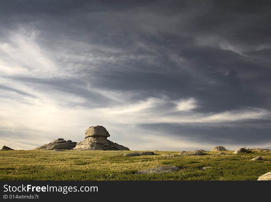 High mountain's rocks, summer, sky and clouds. High mountain's rocks, summer, sky and clouds