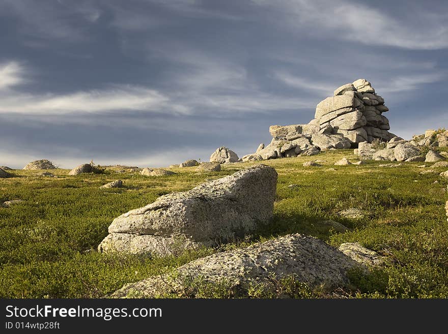 High mountain's rocks, summer, sky and clouds. High mountain's rocks, summer, sky and clouds