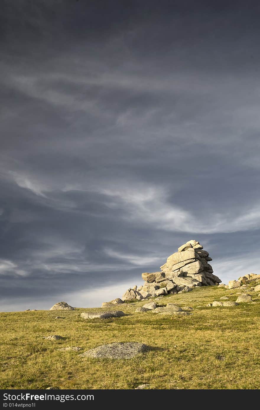 High mountain's rocks, summer, sky and clouds. High mountain's rocks, summer, sky and clouds