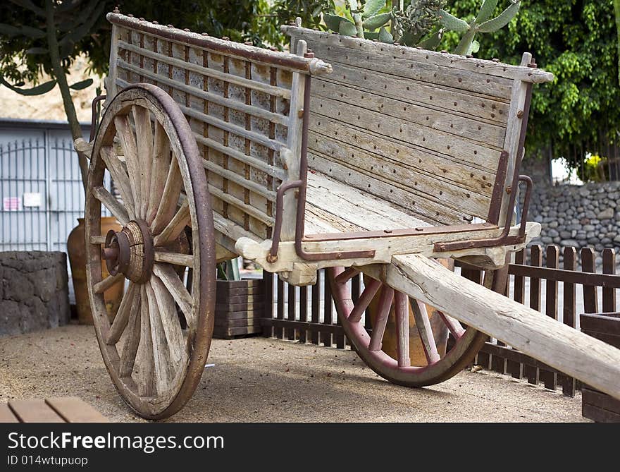 Antique wood cart with big wheels on park. Antique wood cart with big wheels on park