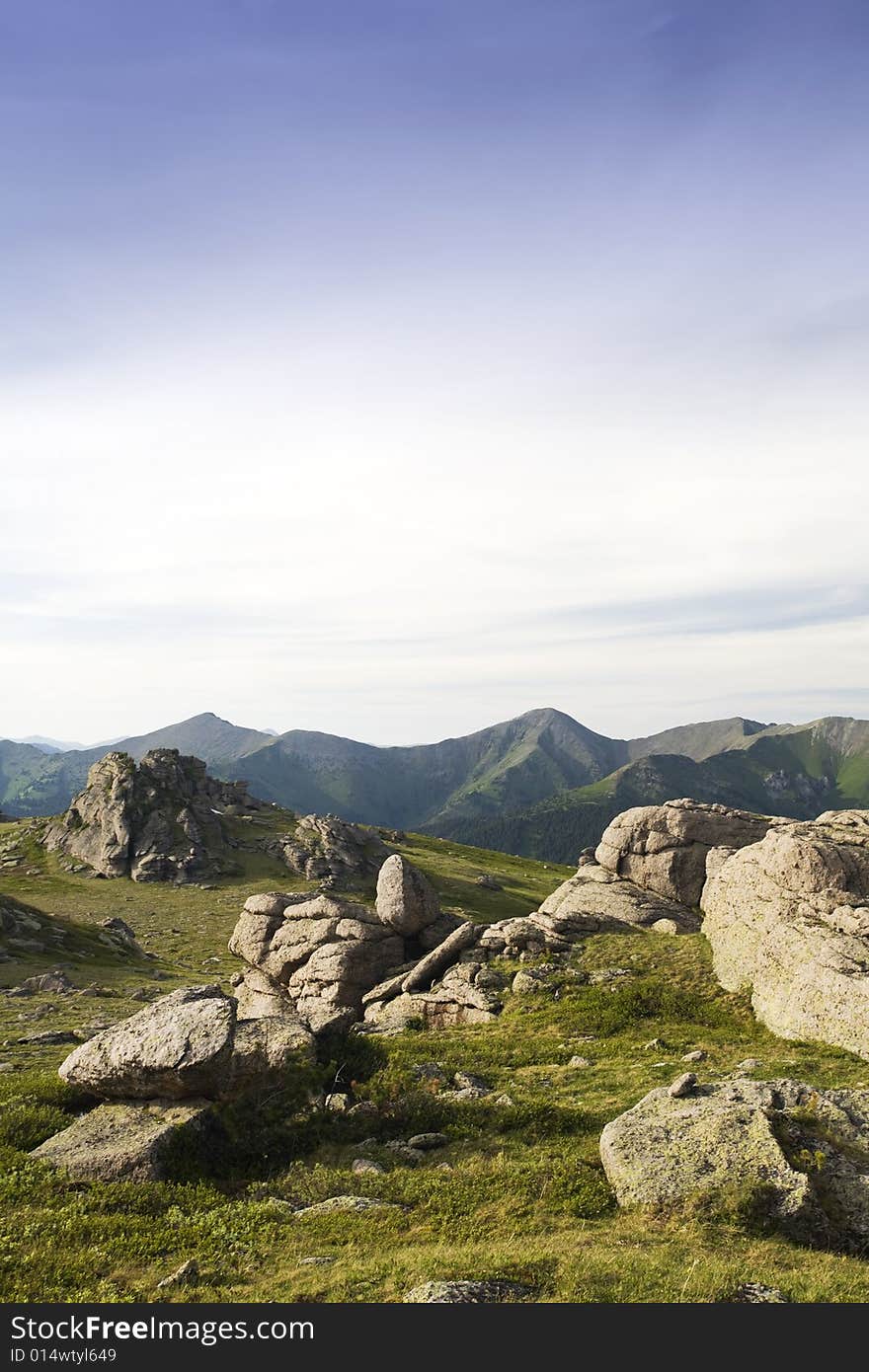 High mountain's rocks, summer, sky and clouds. High mountain's rocks, summer, sky and clouds