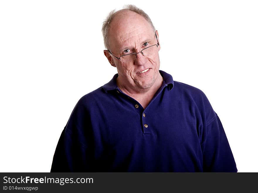 Older Guy in Blue Shirt Smiling Over Glasses