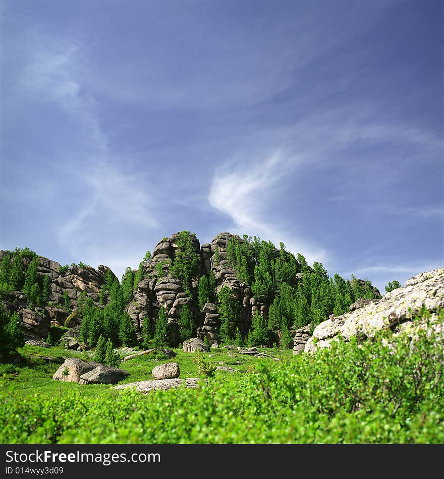 High mountain's rocks, summer, sky and clouds. High mountain's rocks, summer, sky and clouds