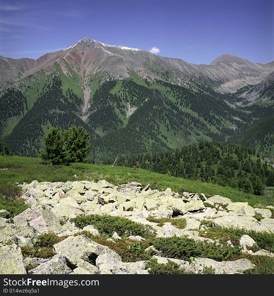 High mountain's rocks, summer, sky and clouds. High mountain's rocks, summer, sky and clouds