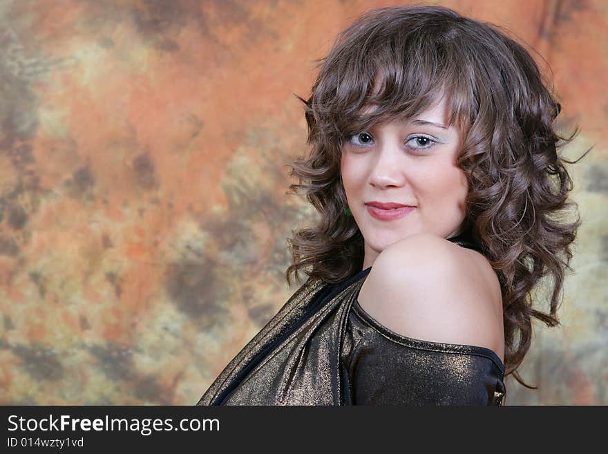 Portrait of the beautiful woman in studio looking forward