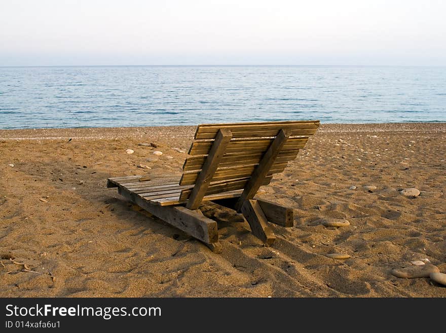 Wooden deck chair on the beach, in Cirali