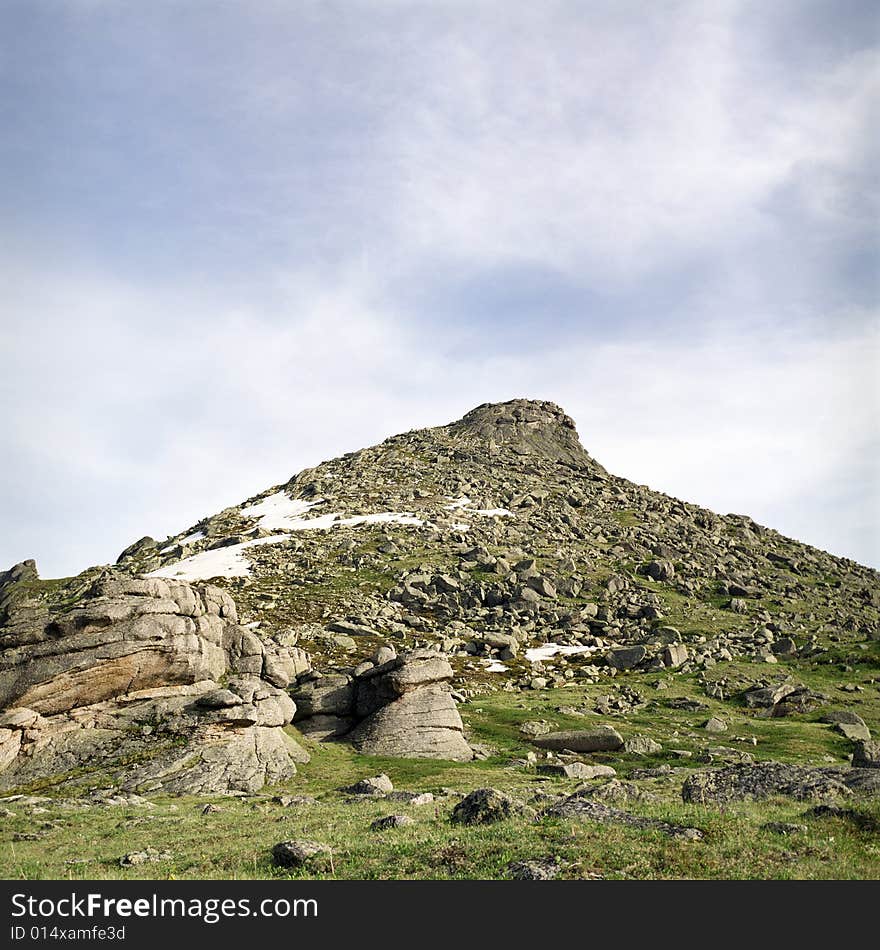 High mountain's rocks, summer, sky and clouds. High mountain's rocks, summer, sky and clouds