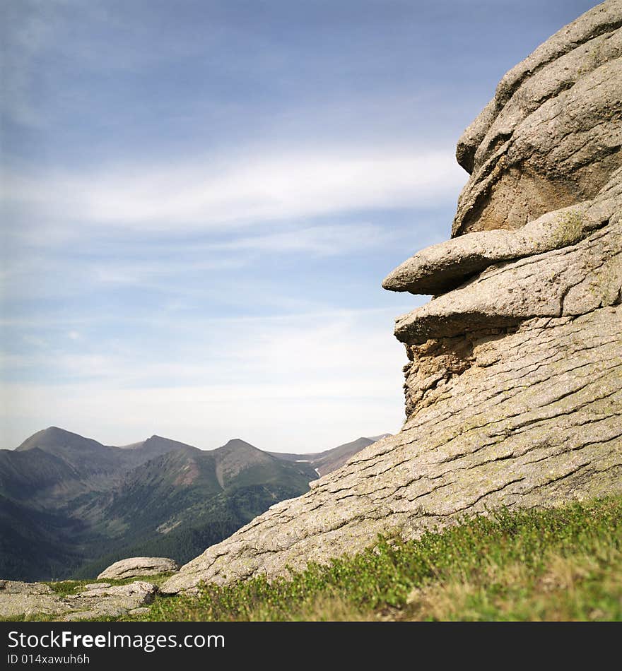 High mountain's rocks, summer, sky and clouds. High mountain's rocks, summer, sky and clouds