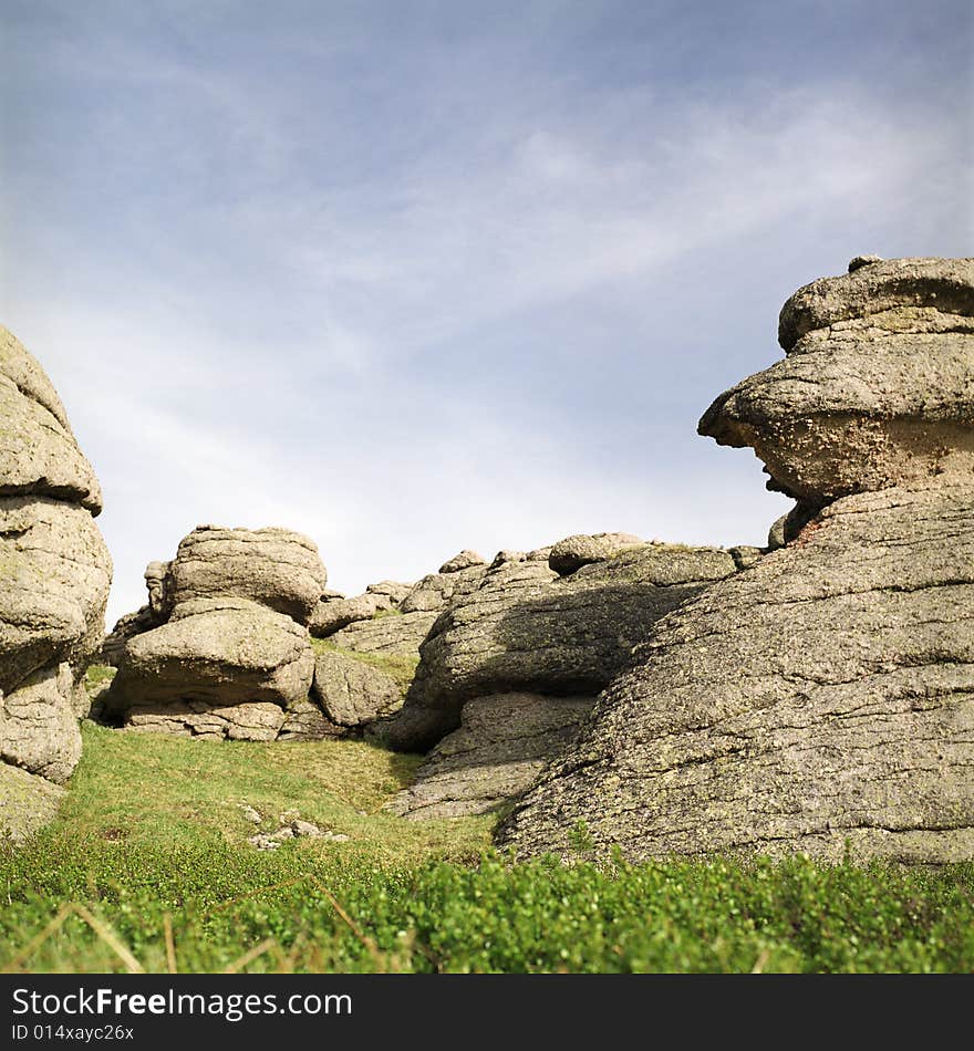 High mountain's rocks, summer, sky and clouds. High mountain's rocks, summer, sky and clouds