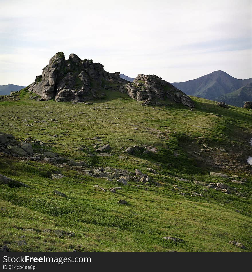 High mountain's rocks, summer, sky and clouds. High mountain's rocks, summer, sky and clouds