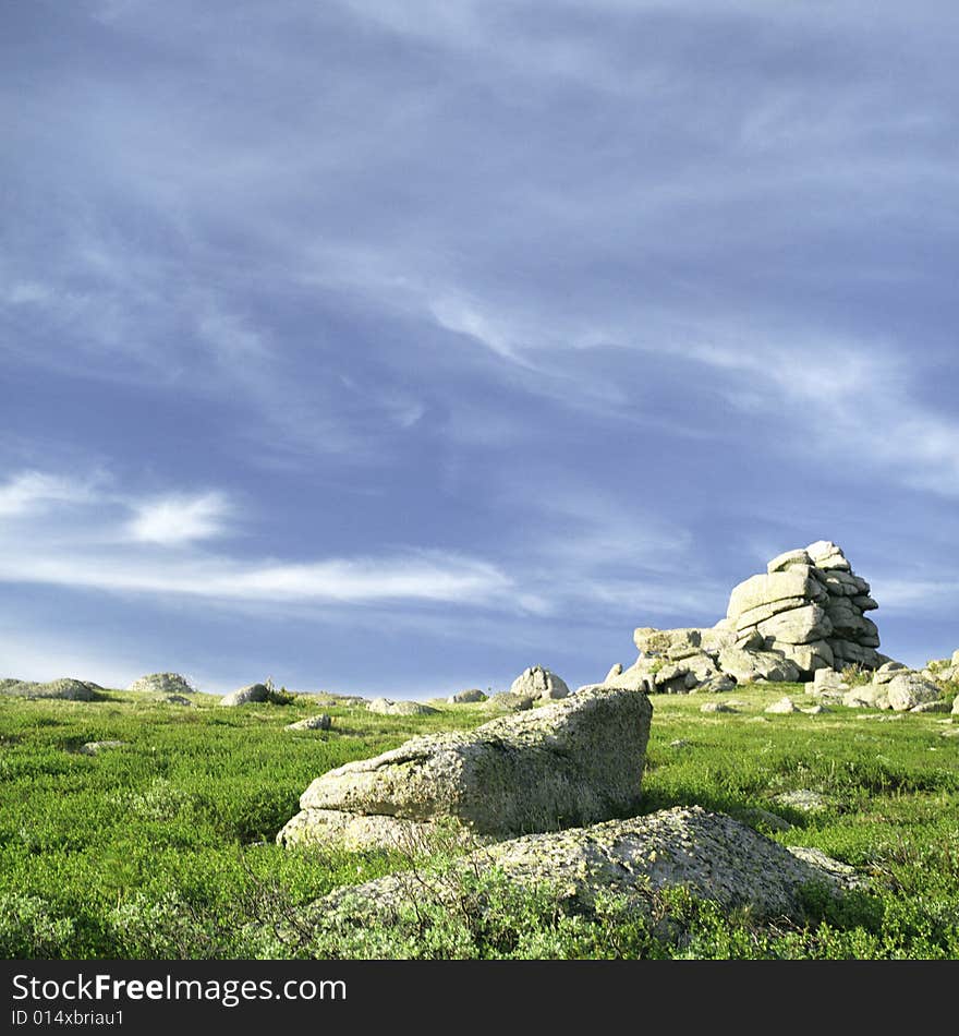 High mountain's rocks, summer, sky and clouds. High mountain's rocks, summer, sky and clouds