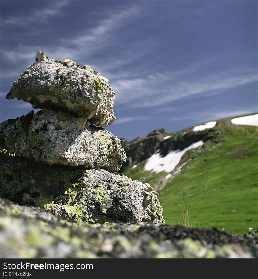 High mountain's rocks, summer, sky and clouds. High mountain's rocks, summer, sky and clouds