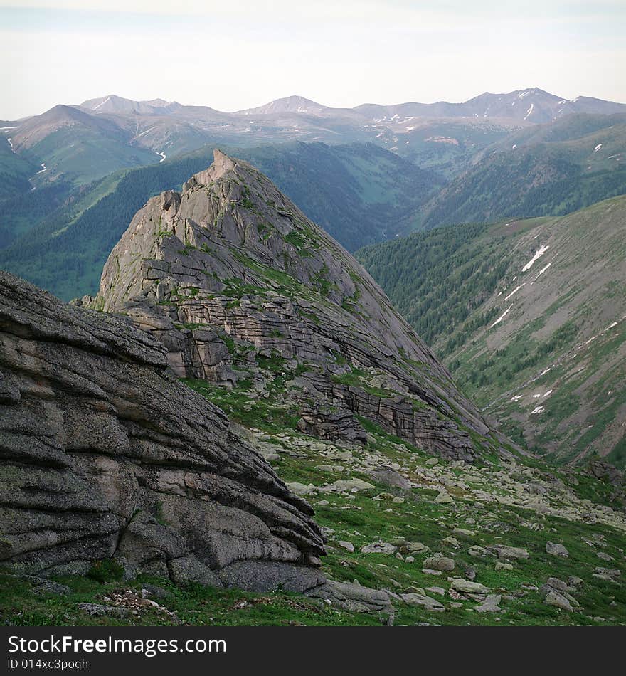 High mountain's rocks, summer, sky and clouds. High mountain's rocks, summer, sky and clouds