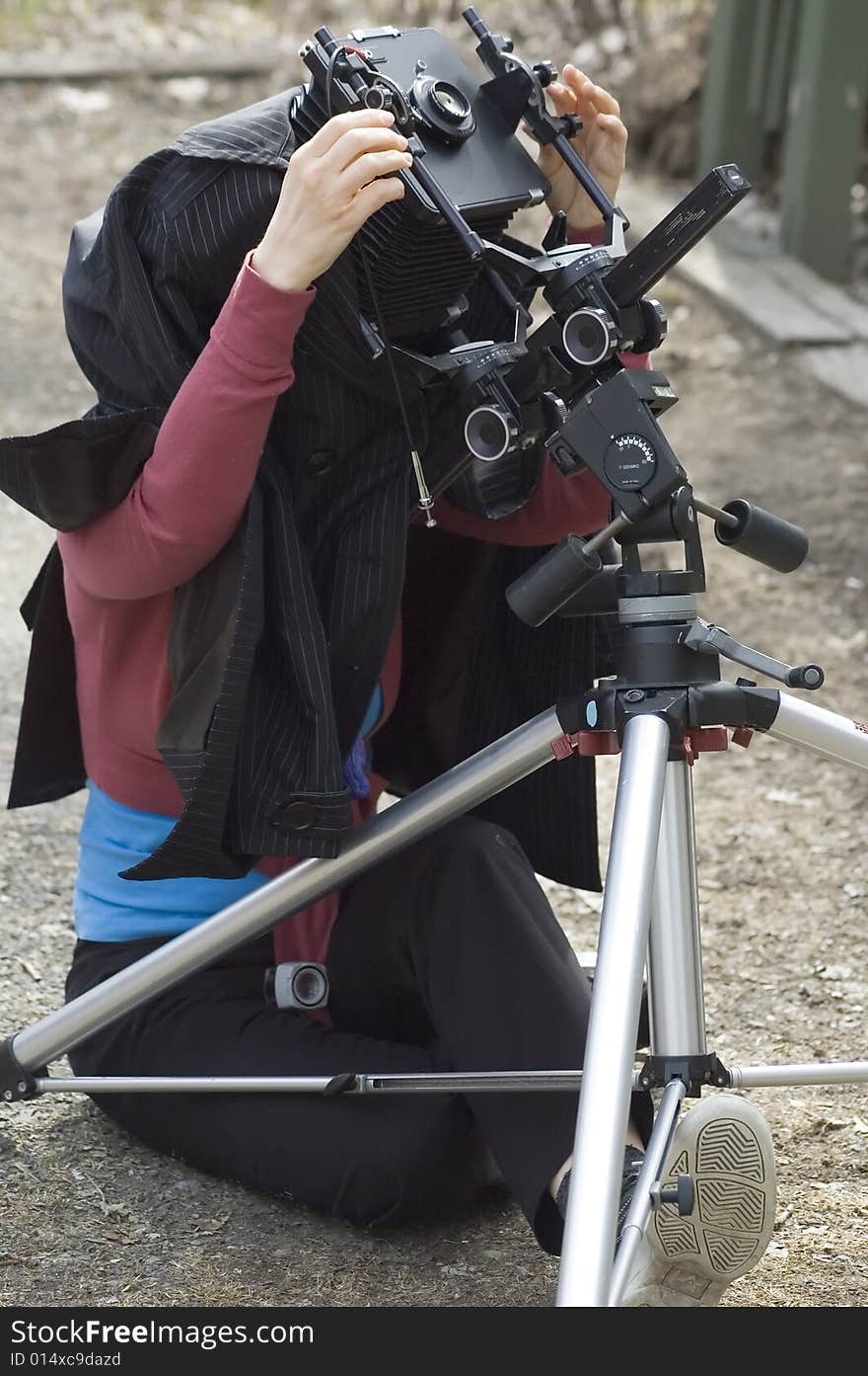 A photographer taking pictures with an old 8 by 10 camera