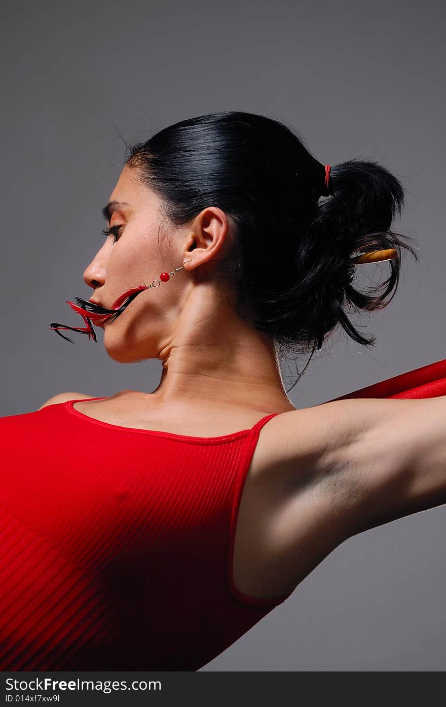 Artistic portrait of young hispanic dancer woman in red clothes. Artistic portrait of young hispanic dancer woman in red clothes