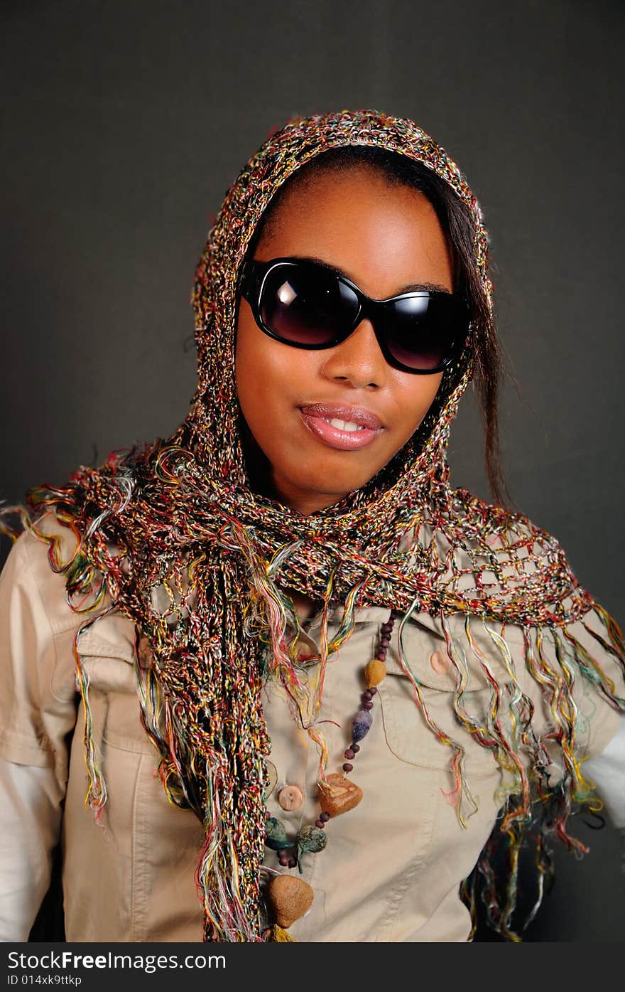 Portrait of young african female model posing with sunglasses. Portrait of young african female model posing with sunglasses