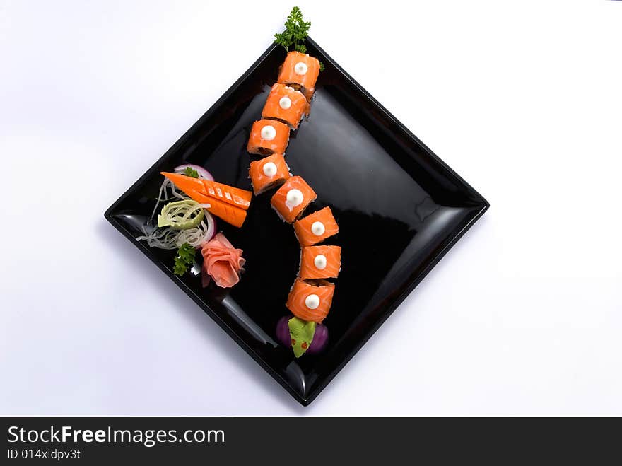 Red roll like dragon on black plate