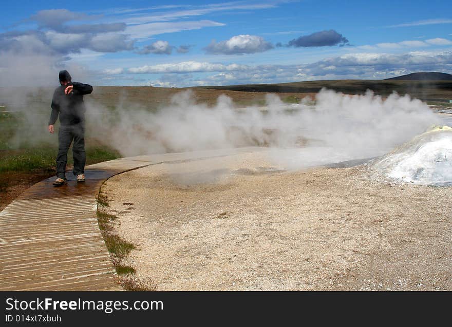 A researcher mext to the fumarole. A researcher mext to the fumarole