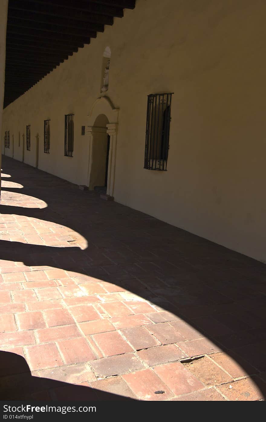 Shadows cast by the arches of the long building of Mission San Fernando, California. Shadows cast by the arches of the long building of Mission San Fernando, California.