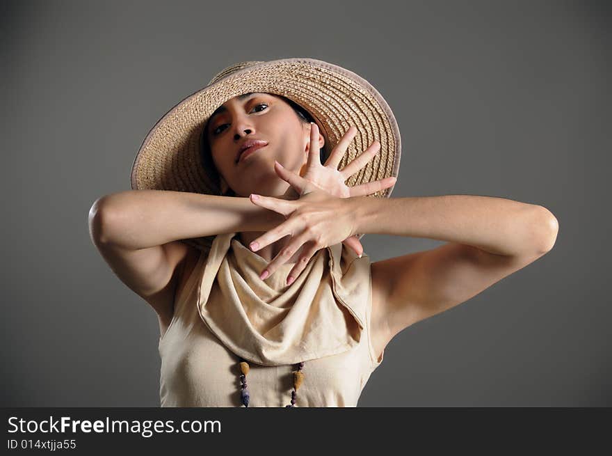 Portrait of young fashion female posing with hat. Portrait of young fashion female posing with hat