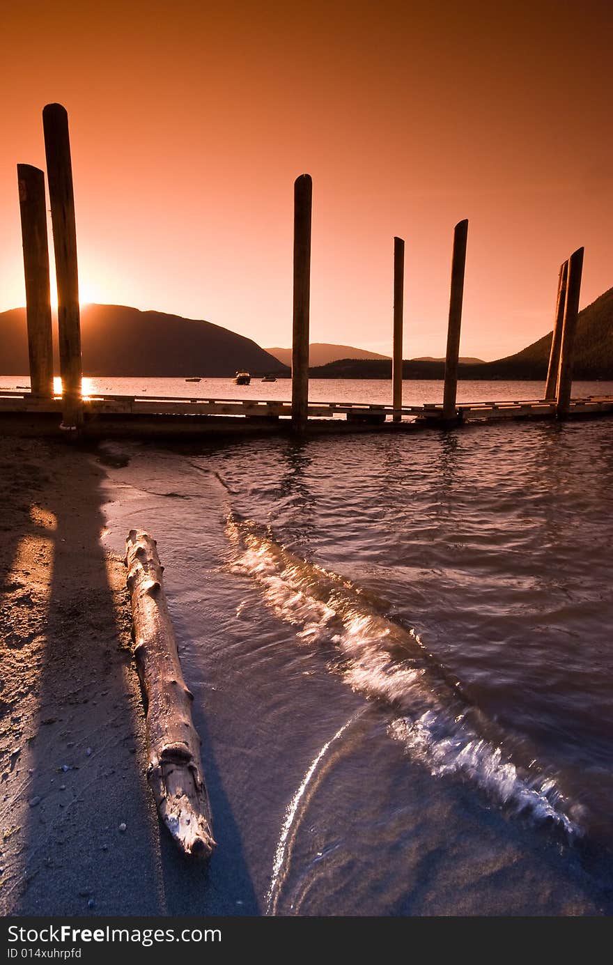 Sunset over Shuswap Lake boardwalk, Salmon Arm, British Columbia, Canada. Sunset over Shuswap Lake boardwalk, Salmon Arm, British Columbia, Canada.