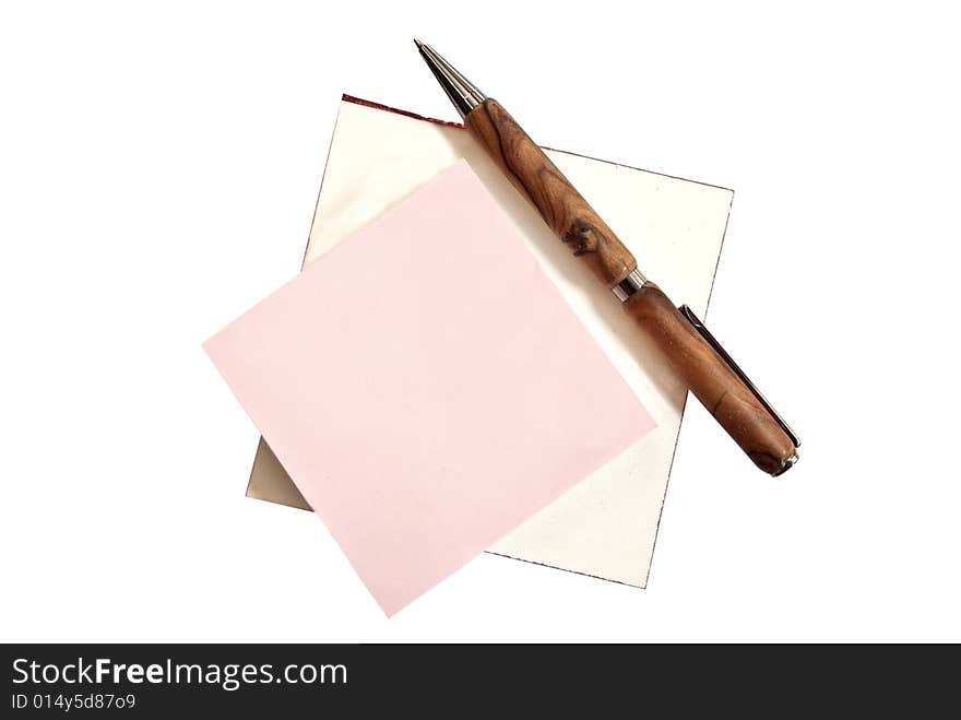 Two writing tablets with a homemade wooden pen on top. Two writing tablets with a homemade wooden pen on top.