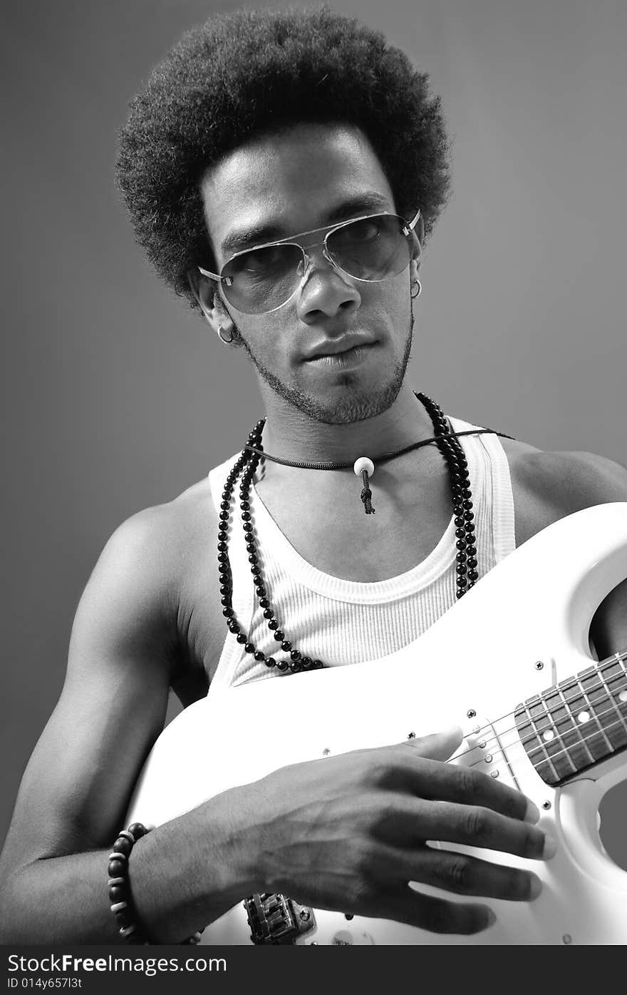 Portrait of young african man playing electric guitar. Portrait of young african man playing electric guitar