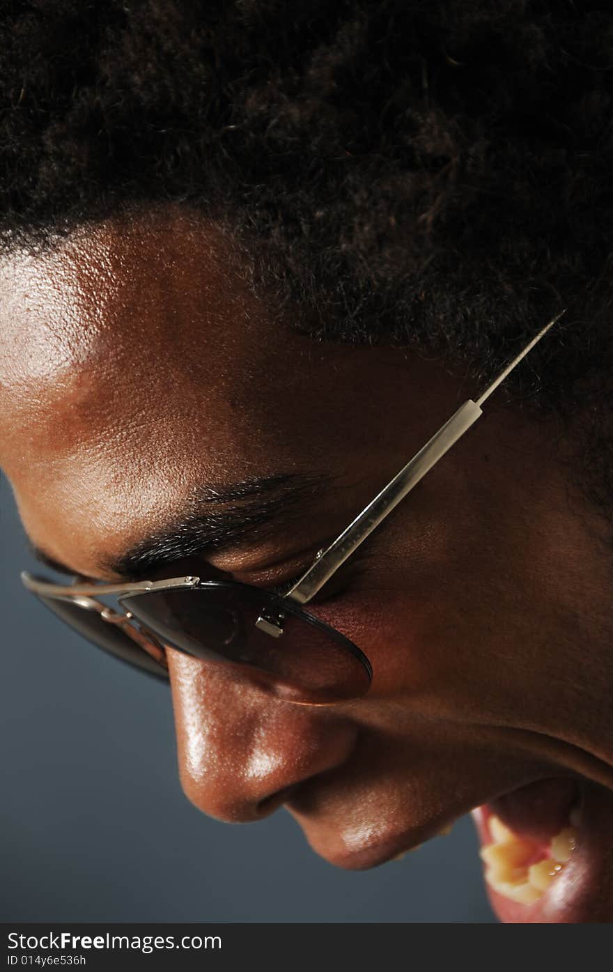 Close up portrait of young african man screaming