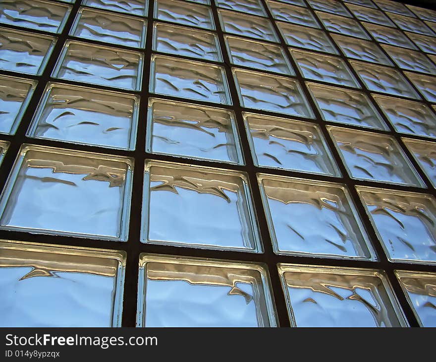 Perspective of a glass bricks wall distorting light. Perspective of a glass bricks wall distorting light