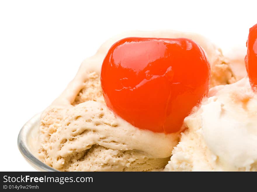 Ice-cream with a cherry in a glass on a white background. Ice-cream with a cherry in a glass on a white background.