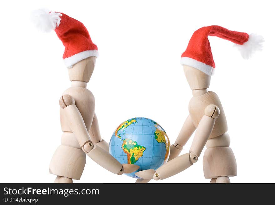 Two little wooden men with globe on a white background