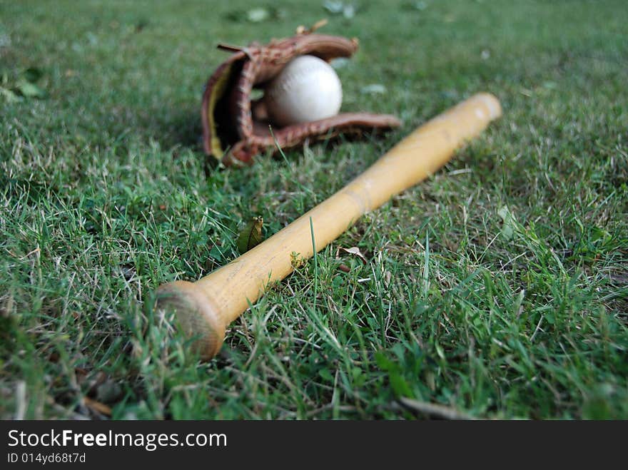 Photo of baseball bat with glove