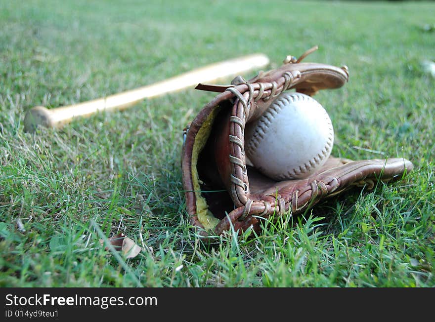 Photo of baseball bat with glove