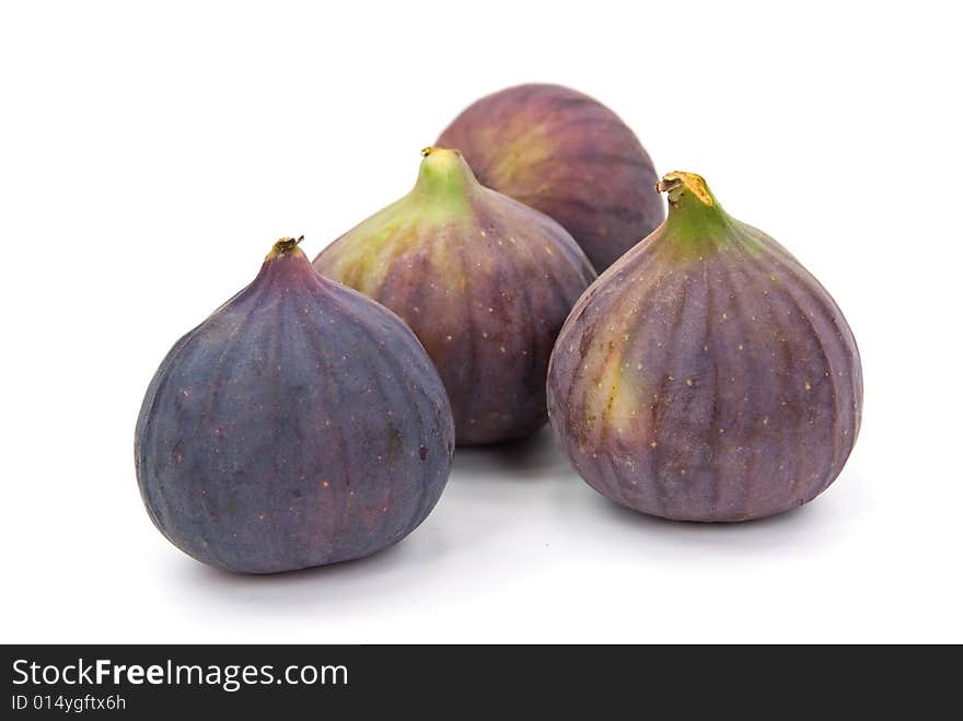 Many ripe,freshly figs on the white background