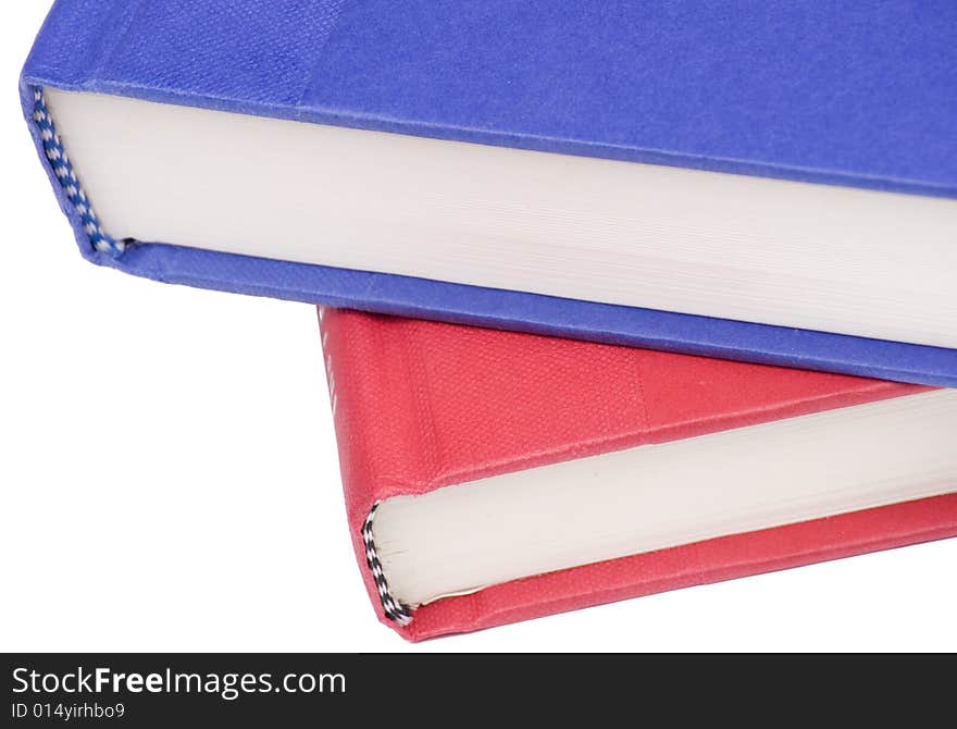 Stacked books on white background