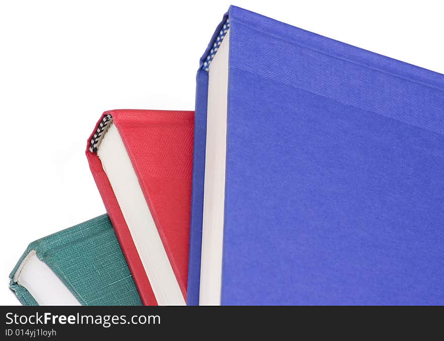 Stacked books on white background