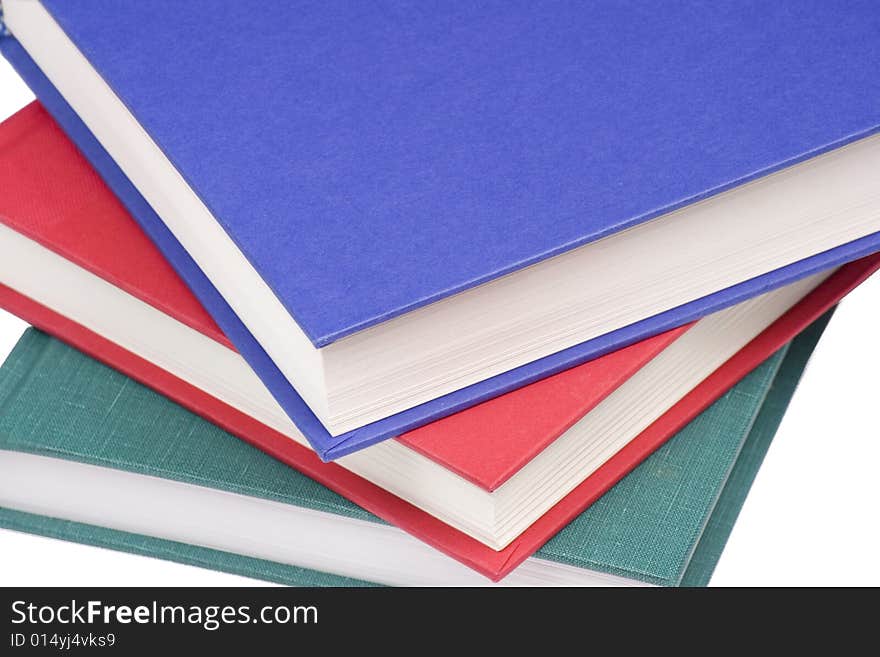 Stacked books on white background