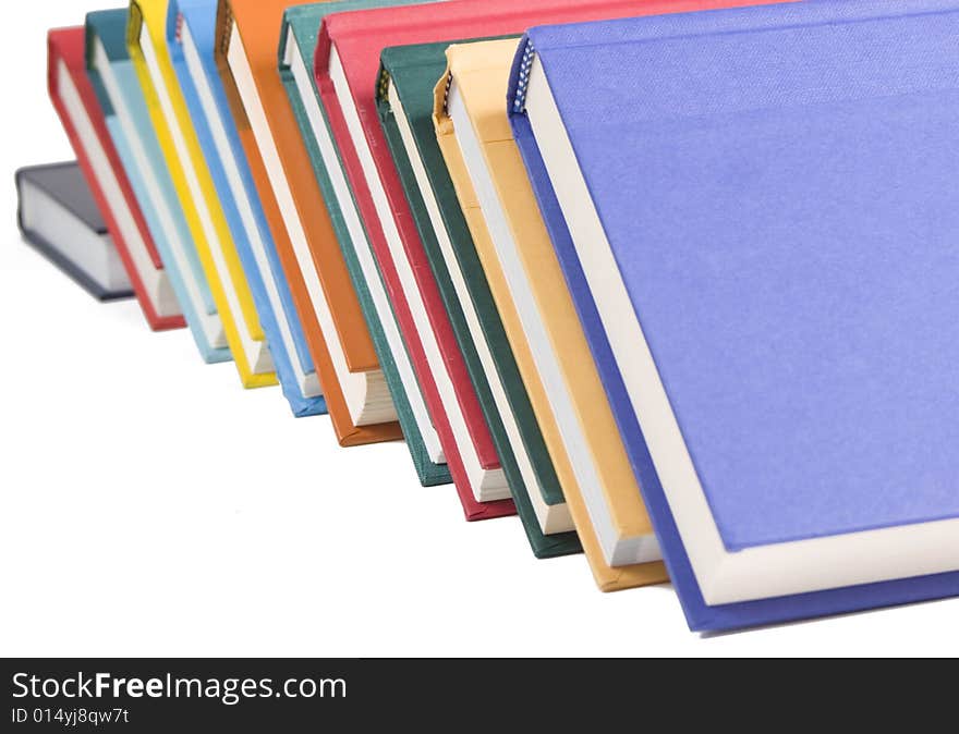 Stacked books on white background