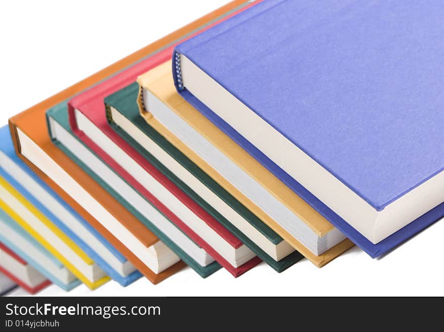 Stacked books on white background