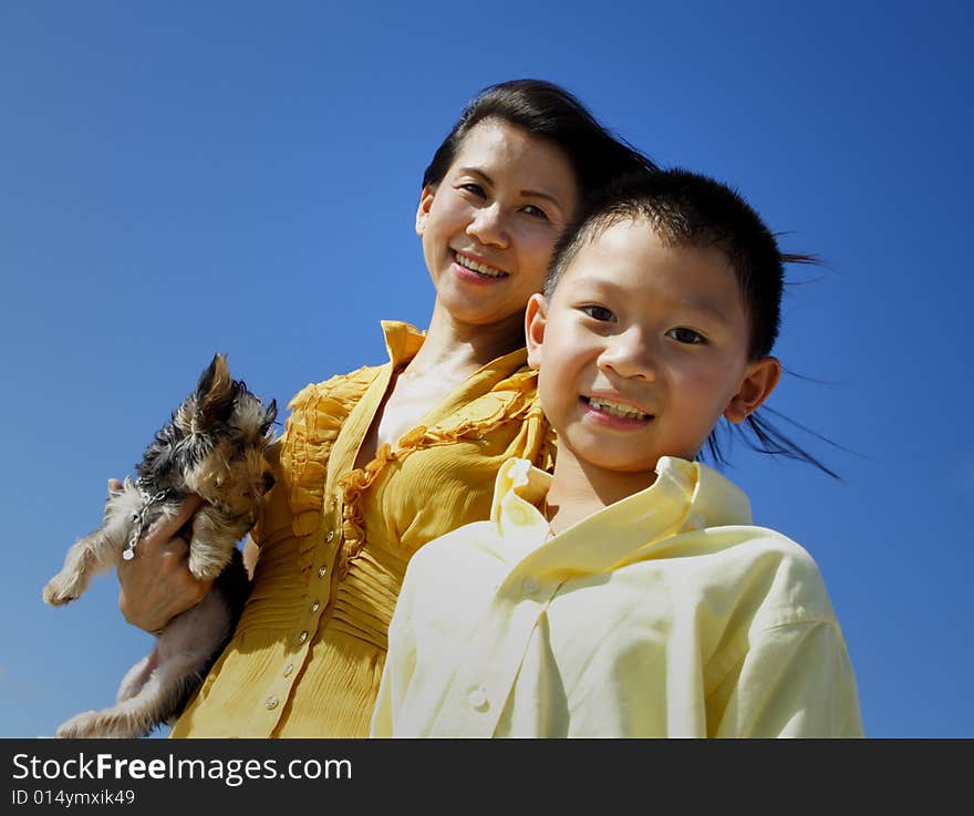 Young child smiling with his mother behind him. Young child smiling with his mother behind him