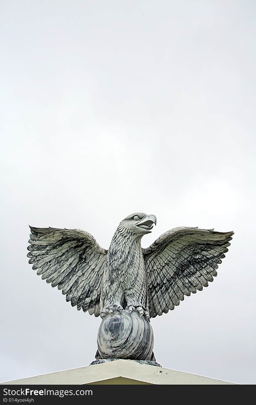 A Marble Statue of an eagle with wings spread. A Marble Statue of an eagle with wings spread