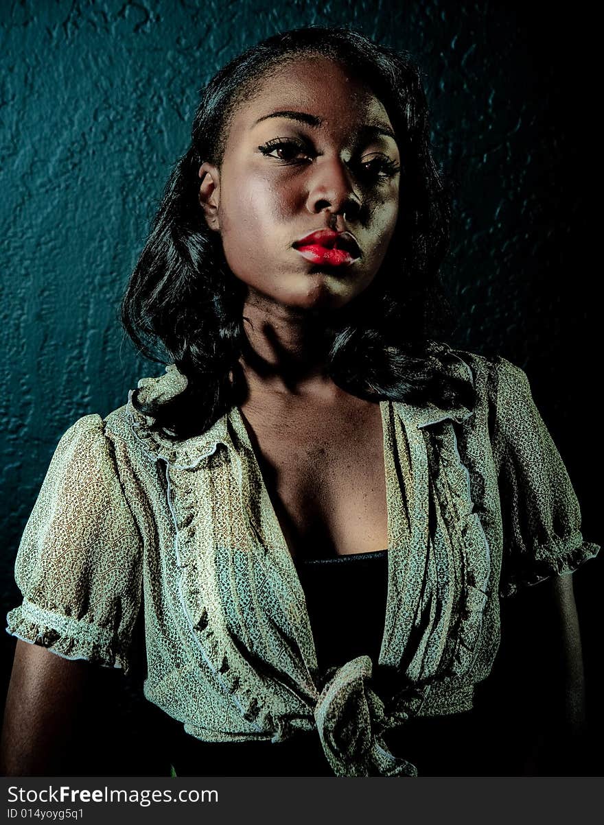 A young african american girl, photographed in the studio.