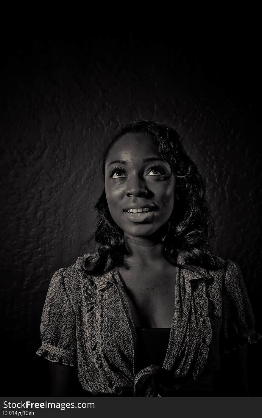 A young african american girl, photographed in the studio.