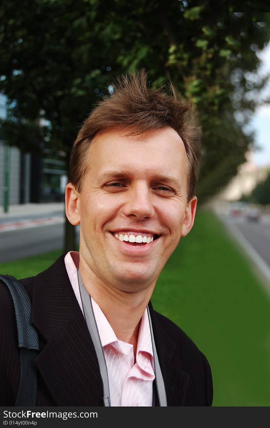 Happy young man in the street