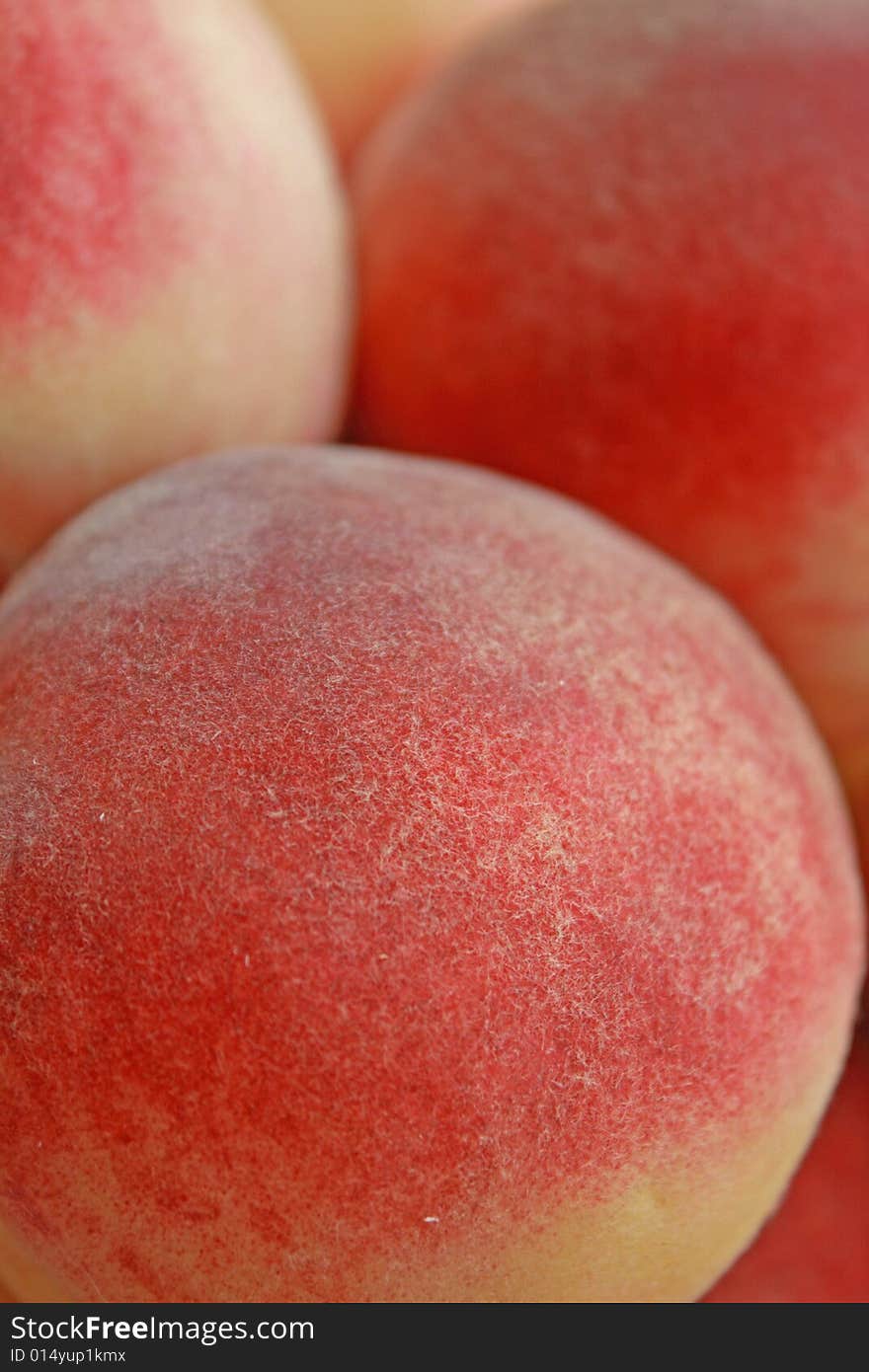 Close up of the fresh ripe peaches.