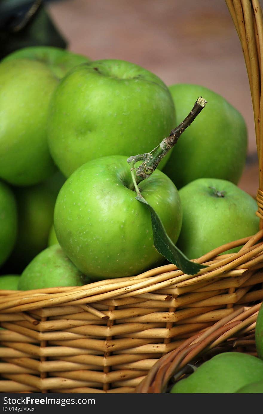 First green, apple’s harvest in the basket. First green, apple’s harvest in the basket.