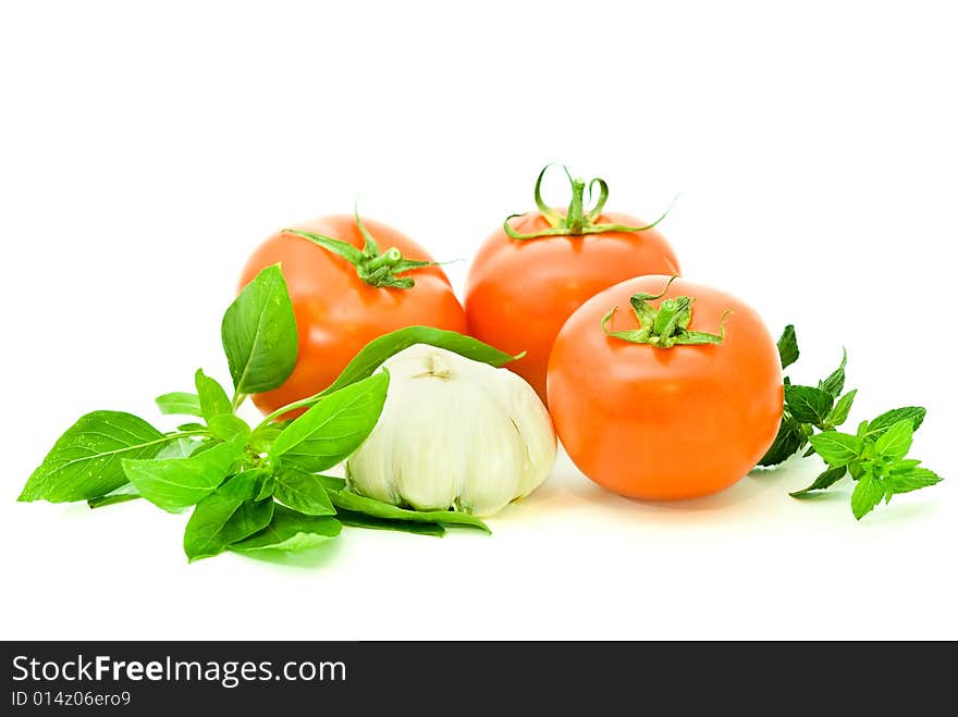 Ripe fresh vegetables with two kinds of basilico over white