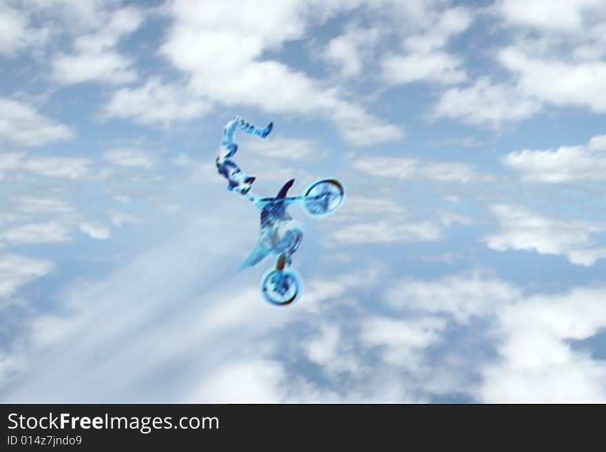 A motion blur of a stunt rider doing tricks on his motorbike against a cloudy sky. A motion blur of a stunt rider doing tricks on his motorbike against a cloudy sky