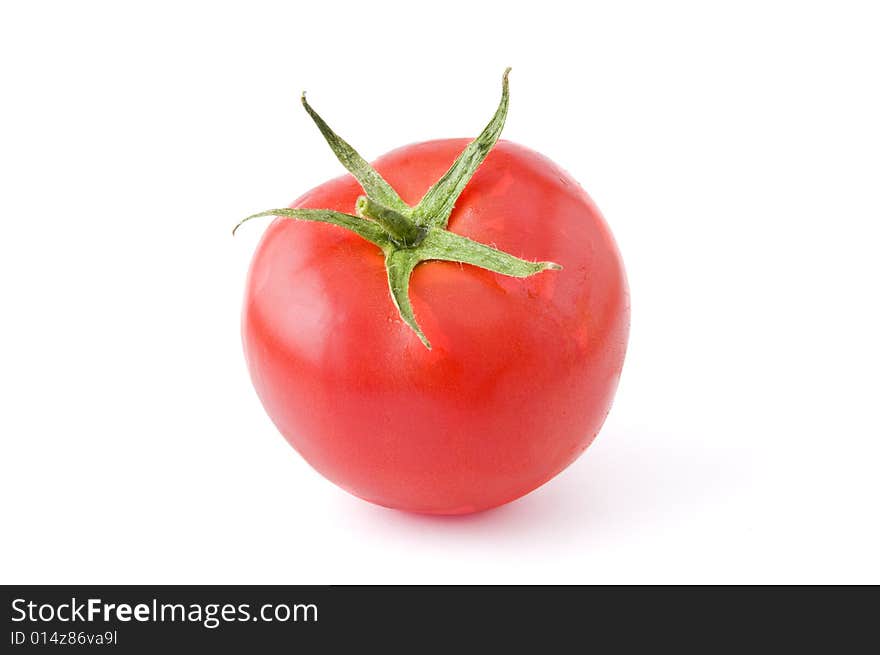 Fresh and ripe tomato isolated on white background. Professional studio image. Fresh and ripe tomato isolated on white background. Professional studio image